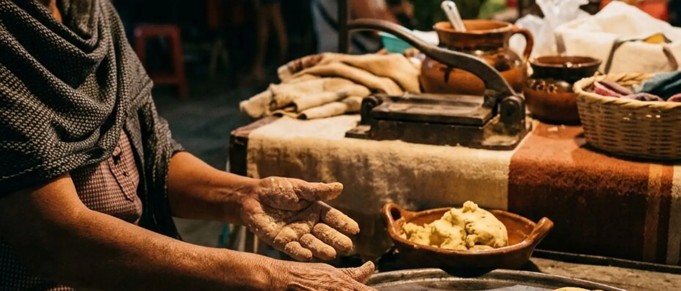 Tortillas on a comal at an Oaxacan street food stall at night